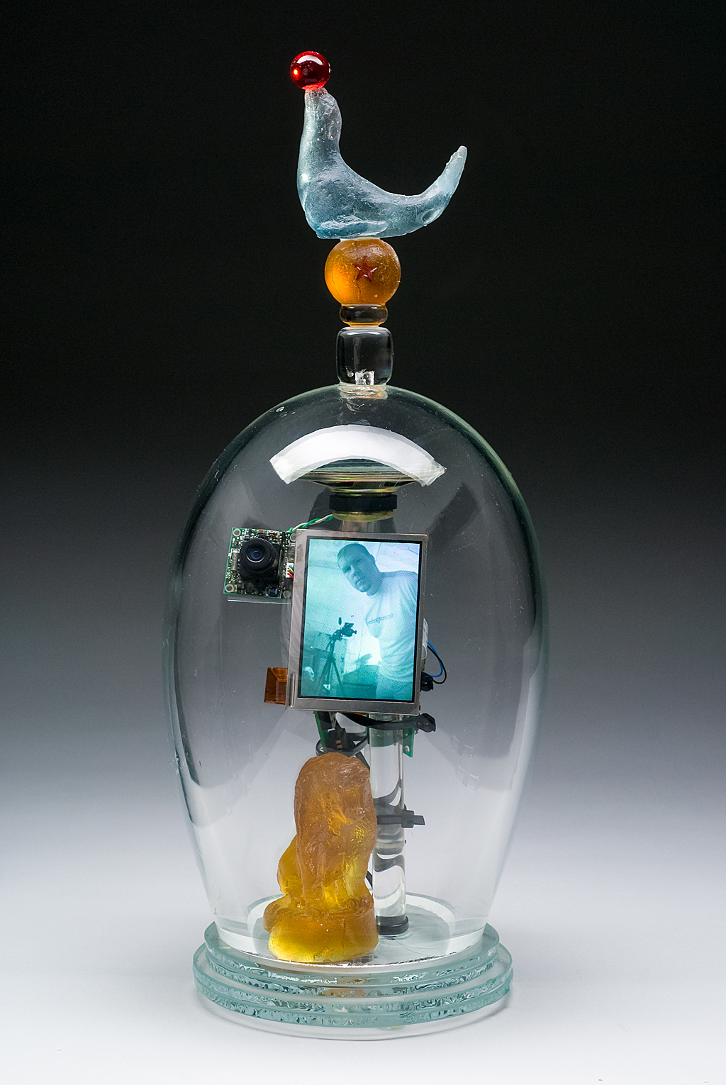 I Want To Run Away and Join the Circus, 2009: Tim Tate. Blown and cast glass, electronic components, original video. Photo:  Anything Photographic