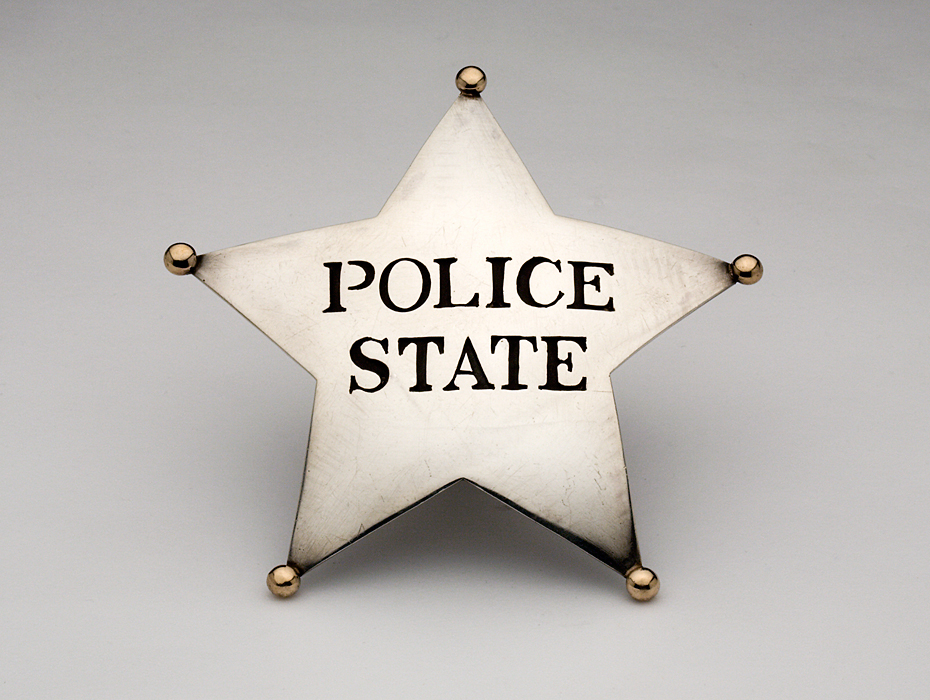 Police State Badge, 1969: William Clark; Sterling silver, 14k gold; Gift of Diane Kuhn, 2012, Photo by Velvet da Vinci Gallery