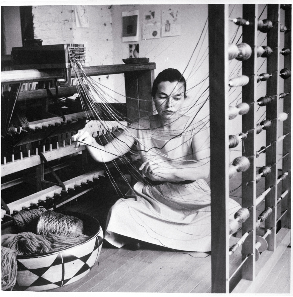 Lenore Tawney in her Coenties Slip studio, New York, 1958.: Courtesy of Lenore G. Tawney Foundation; Photo by David Attie