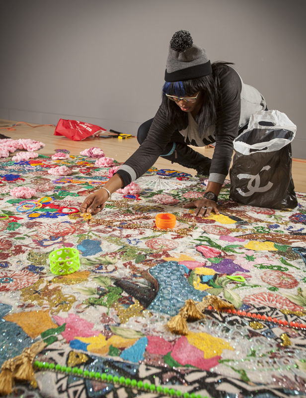 Ebony G. Patterson installing the exhibition Ebony G. Patterson: Dead Treez at the John Michael Kohler Arts Center, 2015: Photo: John Michael Kohler Arts Center